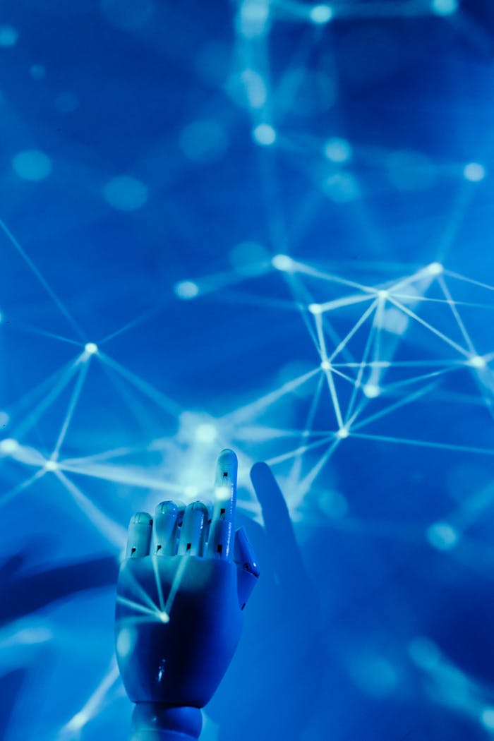 Services-02 Futuristic robotic hand touching a digital network on a blue background.