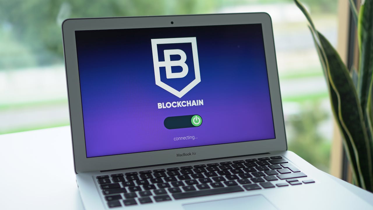 digital A laptop screen displays a blockchain interface, highlighting digital finance technology.